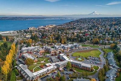 Aerial view of a senior living campus by the waterfront