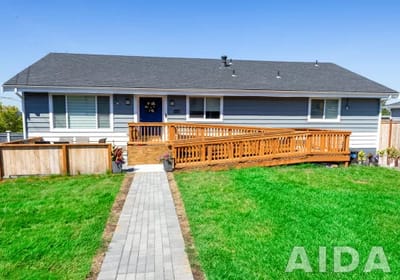 Exterior view of Aspire Adult Family Home with ramp and garden