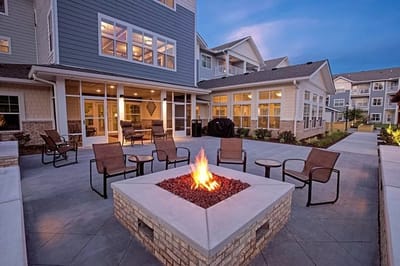 Outdoor patio area with a fire pit and seating