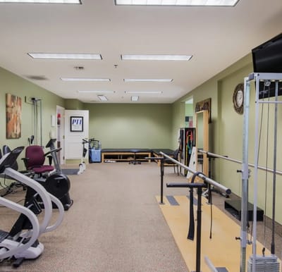 Interior view of a therapy gym with equipment