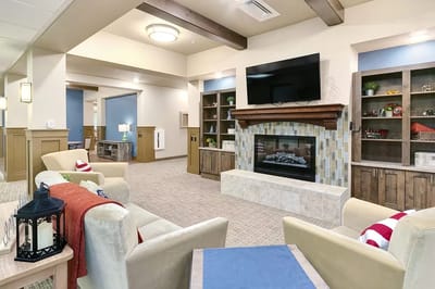 Cozy common area with comfortable seating and a fireplace
