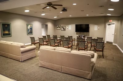 Interior common area with seating and television.