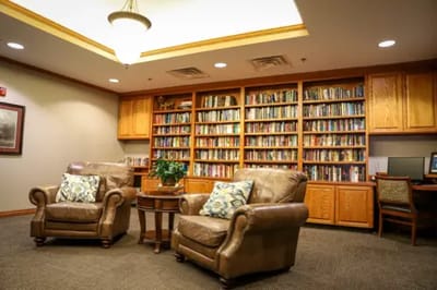Cozy lounge area with bookshelves and seating