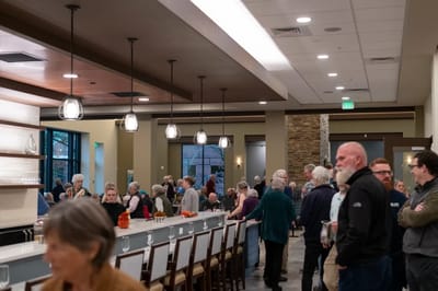 Residents socializing in a dining area during an event