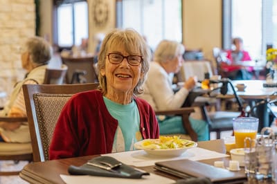 Resident enjoying lunch in the dining room