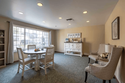 Bright common area with a table and chairs
