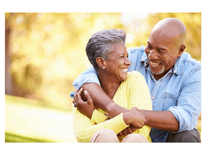 A happy couple enjoying time outdoors in a park