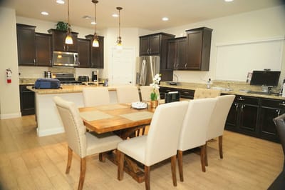 Modern kitchen interior with dining table and chairs