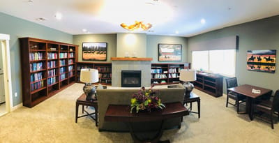 Interior view of a common area with bookshelves and seating
