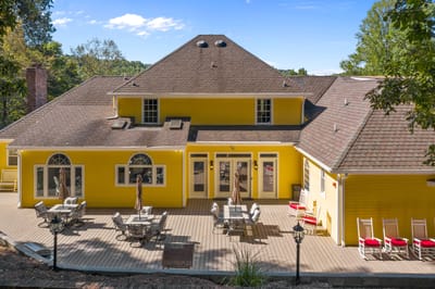 Exterior view of a senior living facility with outdoor seating