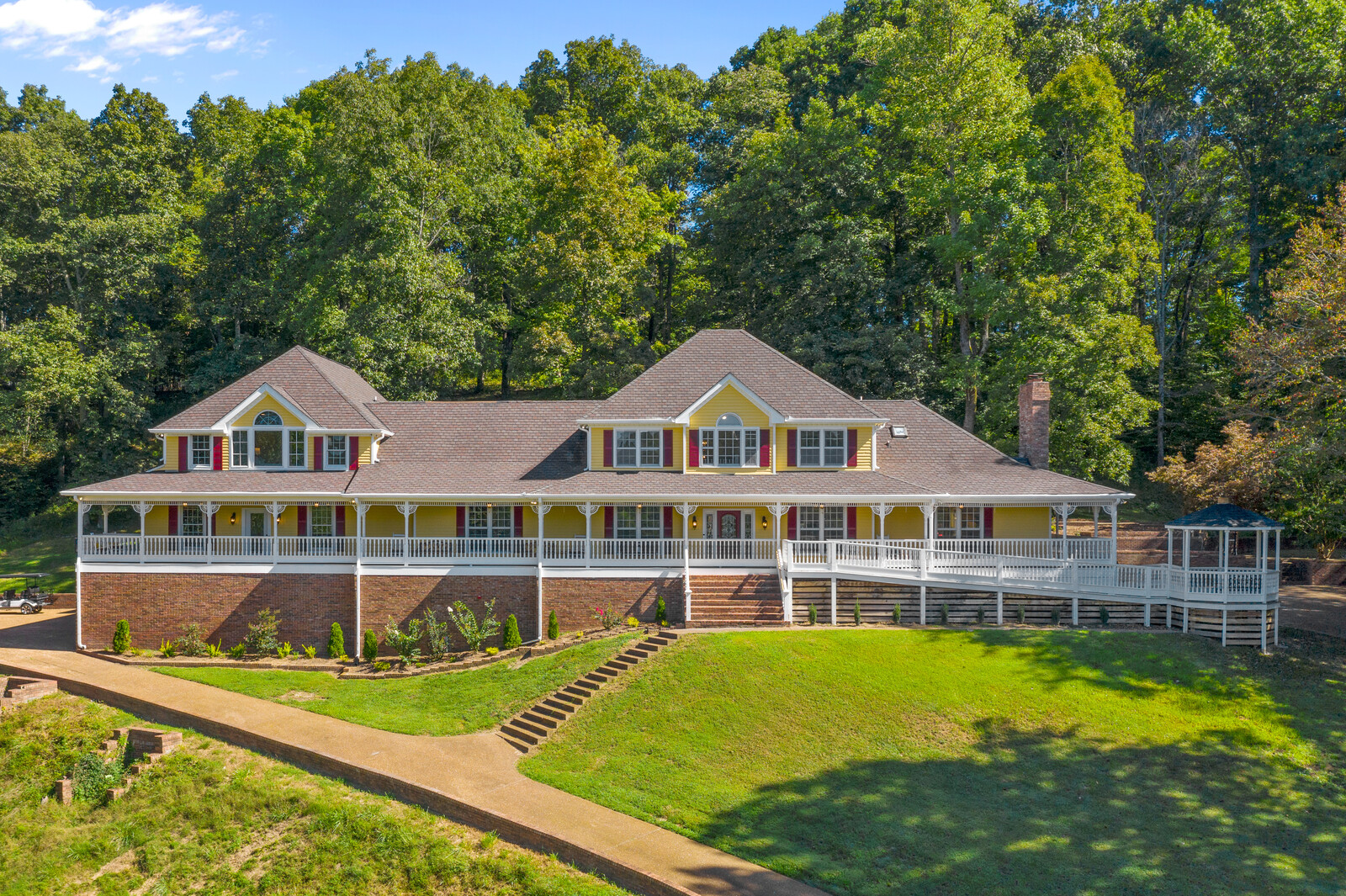 Aerial view of a senior living facility surrounded by trees
