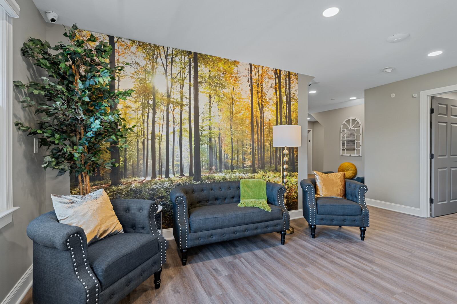 Interior common area with stylish seating and nature mural