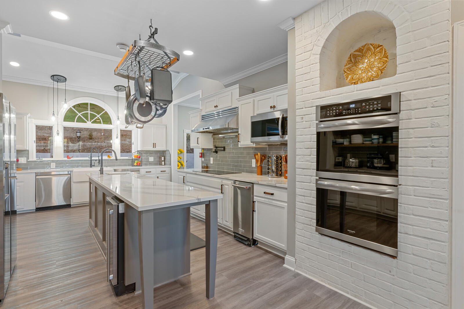 Modern kitchen interior with white cabinets and appliances
