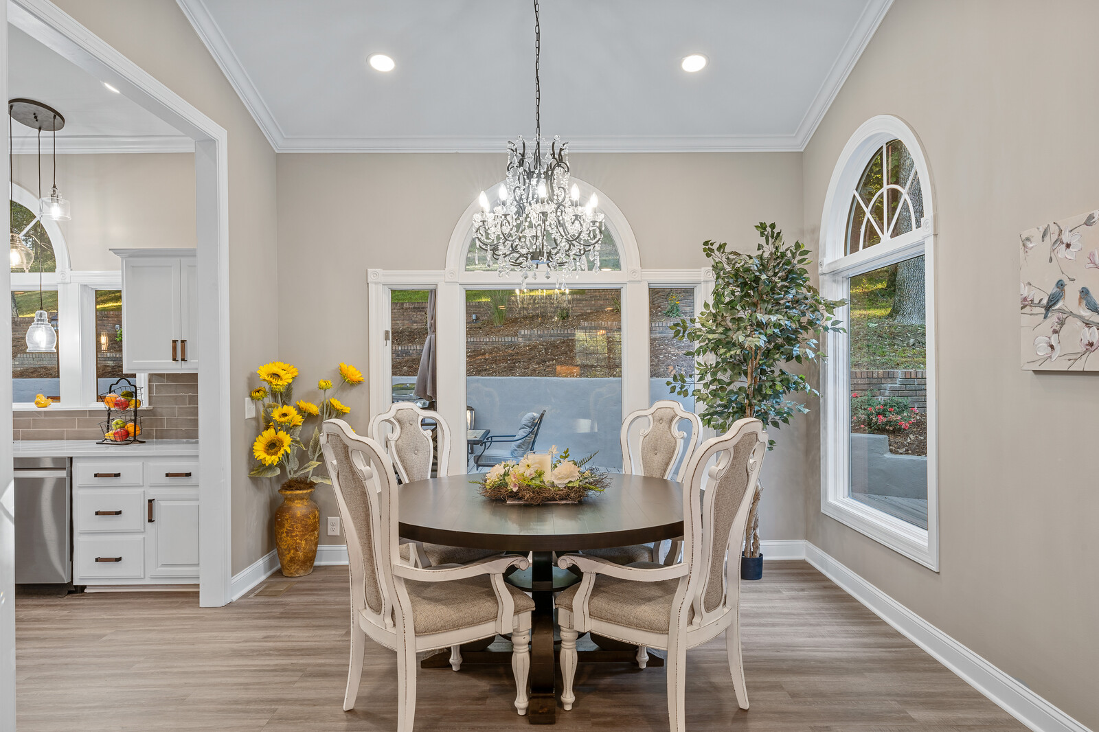 Bright dining area with a round table and elegant decor