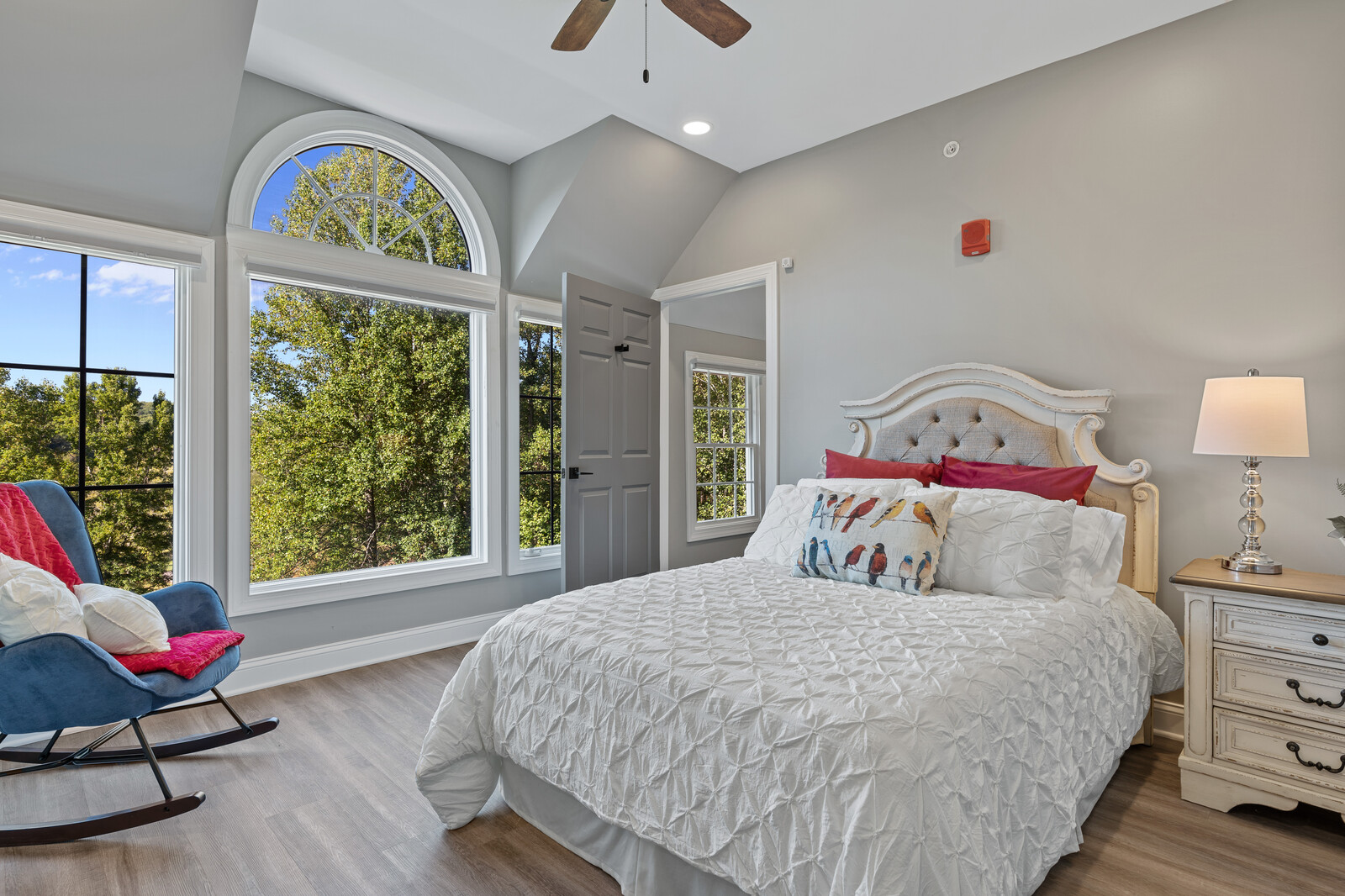 Well-decorated resident room with large windows