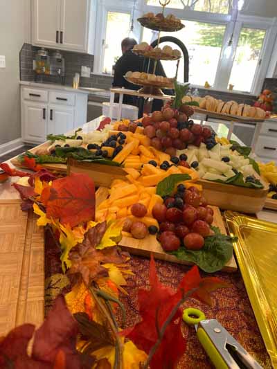 A beautifully arranged food display with residents enjoying it