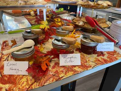 Jars of local honey and preserves on a table