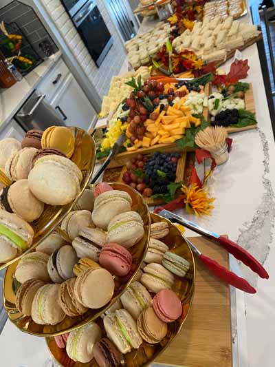 A beautifully arranged food display with desserts and fruits