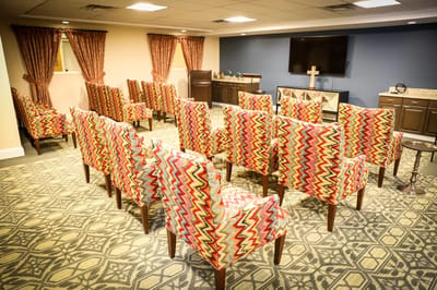 Seating area with colorful patterned chairs