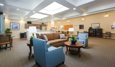 Bright interior common area with seating and plants