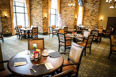 Dining room setup with tables and decorations