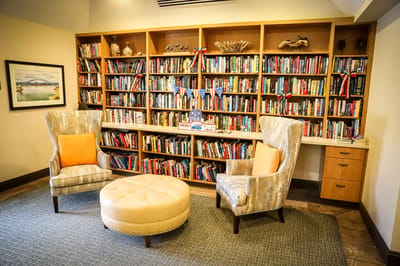 Cozy common area with bookshelves and seating