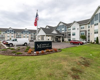 Exterior view of Mira at Maumelle with logo