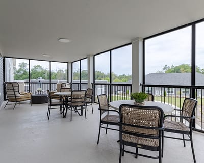 Outdoor sitting area with tables and chairs