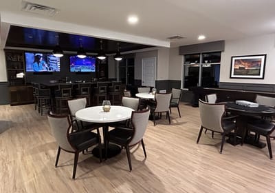 Common area with tables and seating in the facility