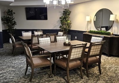 A well-furnished dining area in a senior living facility