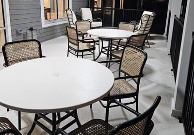 Outdoor seating area with tables and chairs