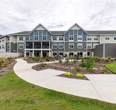 Exterior view of the facility with landscaped gardens