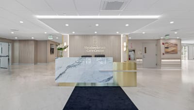 Bright and welcoming reception area with marble desk