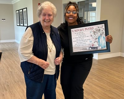 A resident and staff member sharing a moment