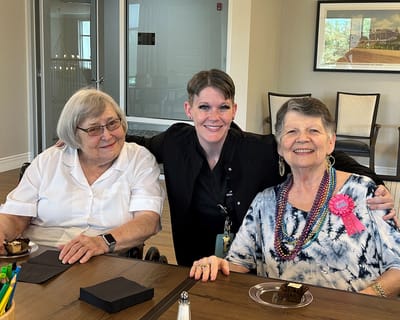 Residents celebrating with a staff member