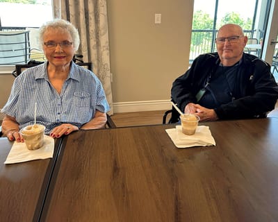 Two residents enjoying ice cream in a common area