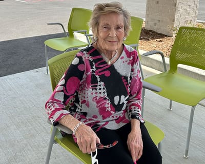 A resident enjoying the outdoors in a colorful outfit
