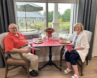 Residents enjoying a meal in the dining area