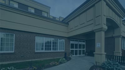 Entrance of a senior care facility with landscaping