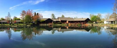 Scenic view of Mennonite Village by a serene lake