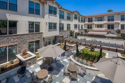 Outdoor courtyard with seating and gardens