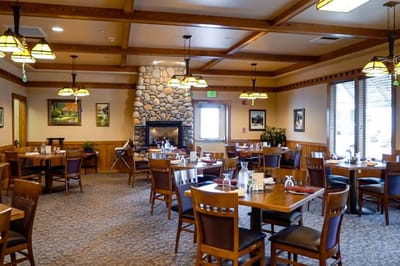 Dining room with wooden tables and chairs
