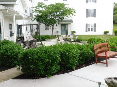 Well-maintained outdoor garden area with seating