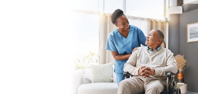 Caregiver interacting with a resident in a cozy living space