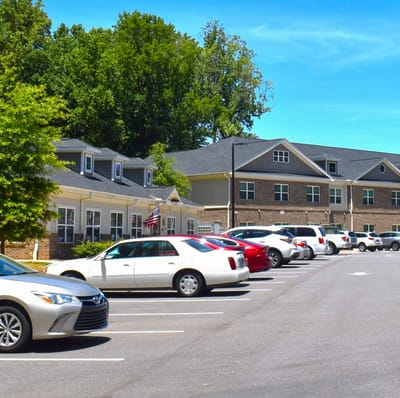 Parking lot and building exterior of Trinity Elms Assisted Living