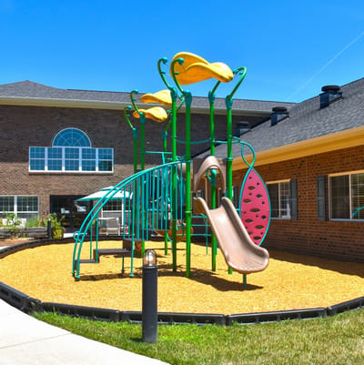 Playground equipment in an outdoor space at Trinity Elms