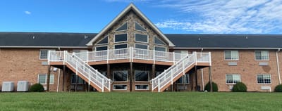 Exterior view of Shenandoah Senior Living with steps and lawn