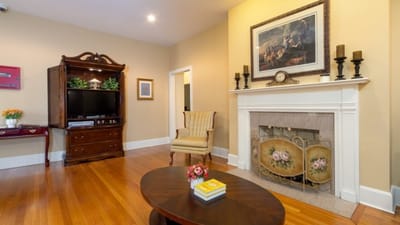 Cozy common area with a chair and fireplace