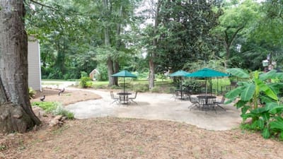 Outdoor seating area with tables and umbrellas