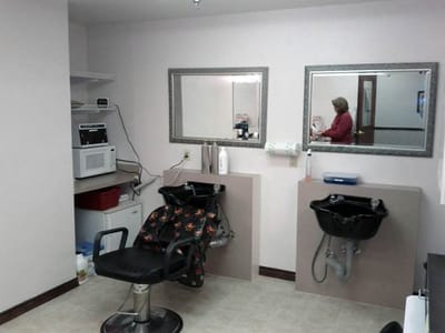 Interior view of a beauty salon with hair washing stations